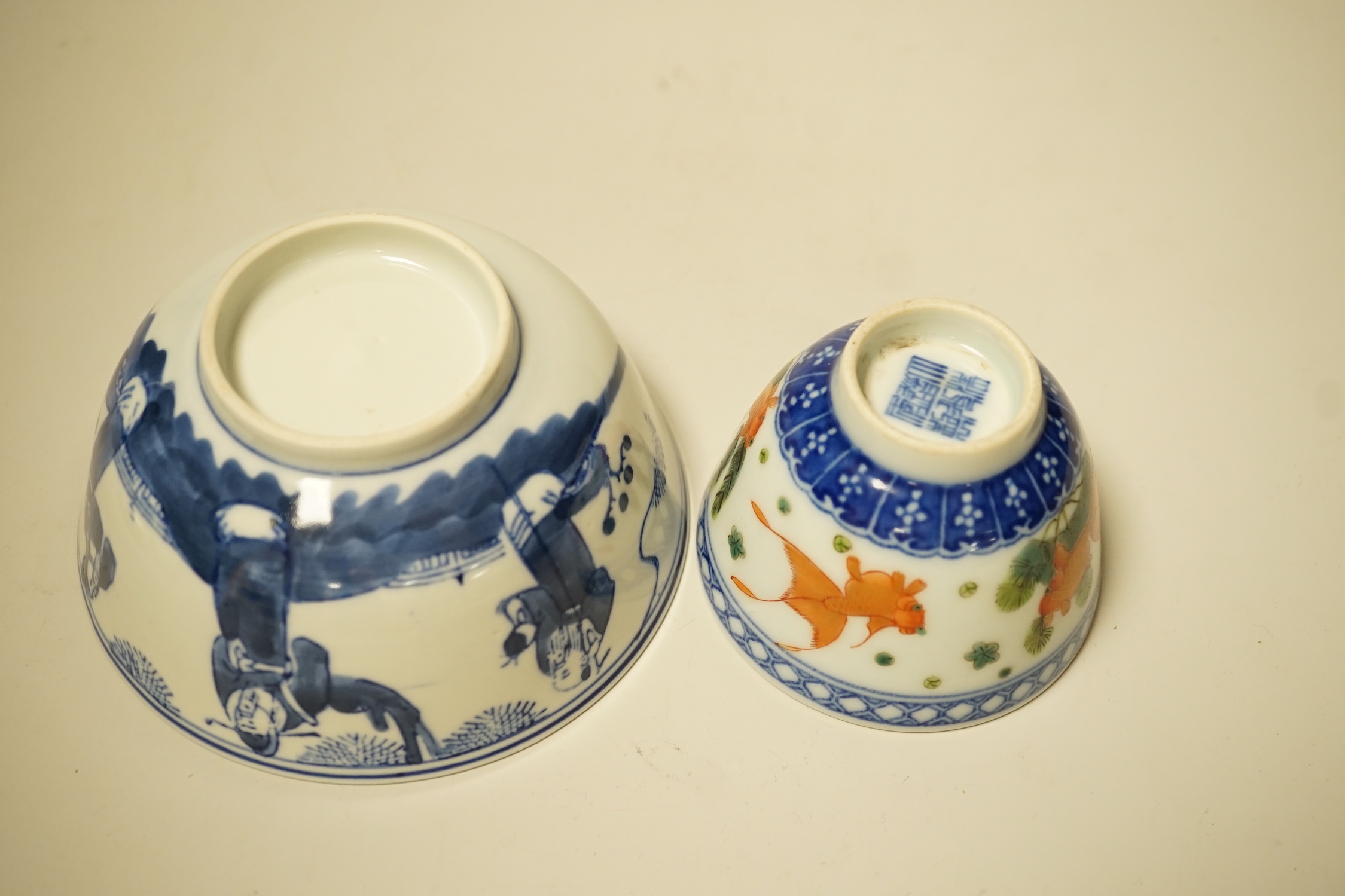 A 19th century Chinese blue and white bowl, an enamelled goldfish cup and two snuff bottles